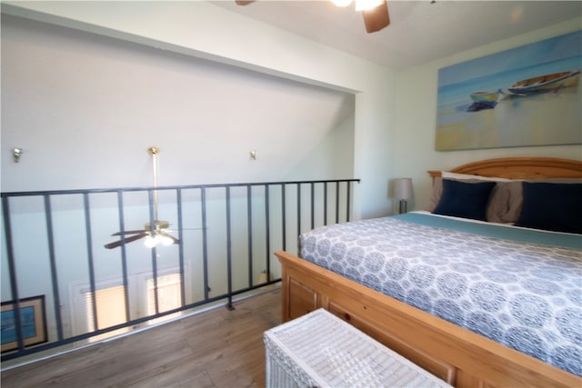 bedroom featuring dark hardwood / wood-style flooring and ceiling fan