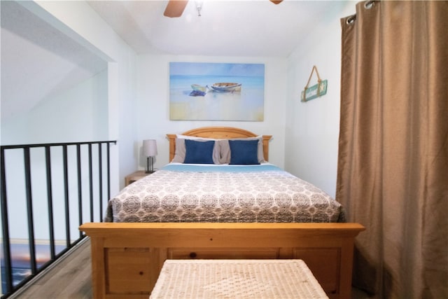 bedroom featuring hardwood / wood-style flooring and ceiling fan