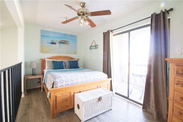 bedroom featuring hardwood / wood-style flooring, ceiling fan, and access to exterior