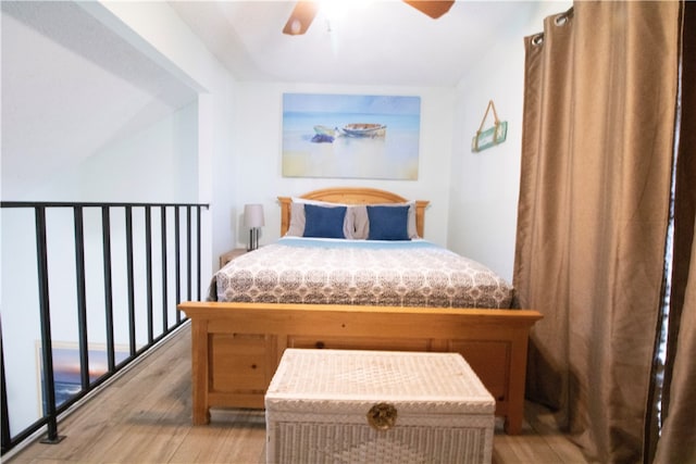 bedroom with light wood-type flooring and ceiling fan