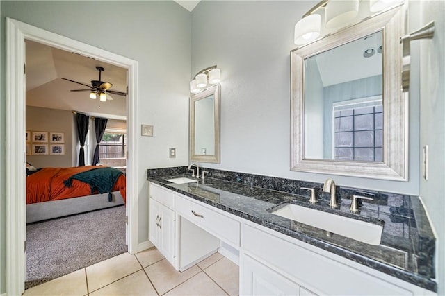4230 Rapids Dr, Corpus Christi, TX 78410 - full bathroom featuring double vanity, connected bathroom, tile patterned flooring, ceiling fan, and lofted ceiling