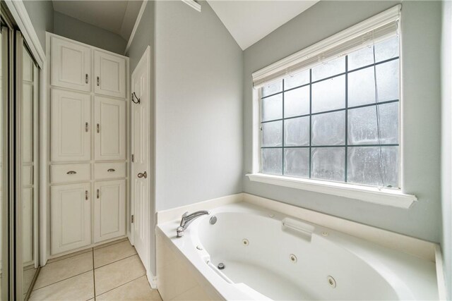 4230 Rapids Dr, Corpus Christi, TX 78410 - full bath featuring a tub with jets, tile patterned flooring, a closet, and lofted ceiling