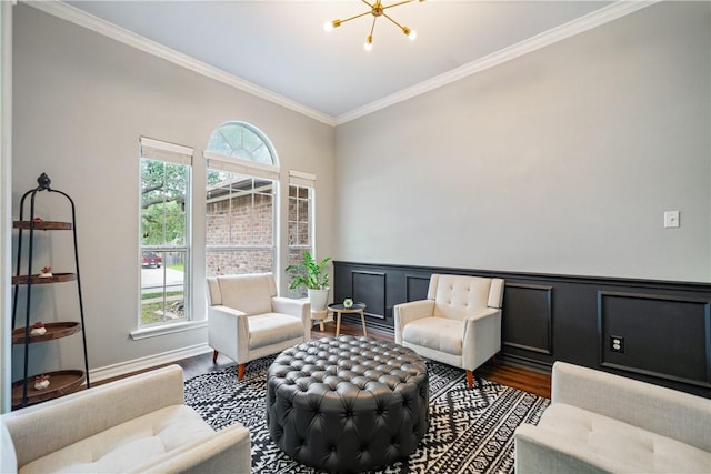 4230 Rapids Dr, Corpus Christi, TX 78410 - living area featuring wood finished floors, crown molding, a chandelier, and wainscoting