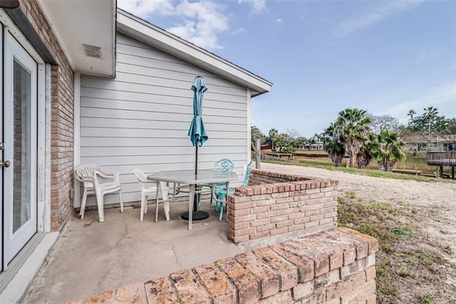 view of patio featuring outdoor dining area