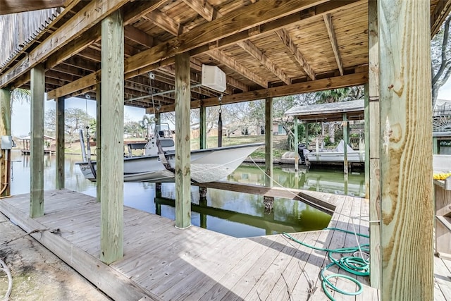 view of dock with a water view and boat lift