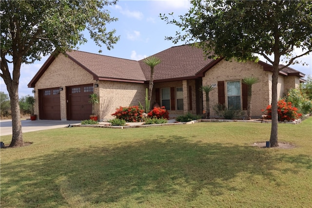 view of front of home with a garage and a front yard