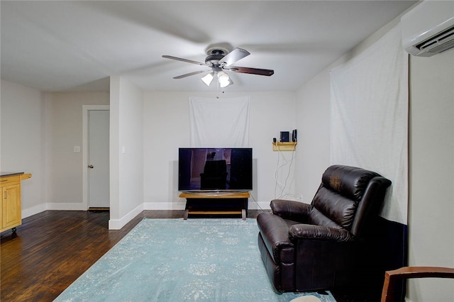 living area featuring ceiling fan, a wall mounted air conditioner, and dark hardwood / wood-style floors