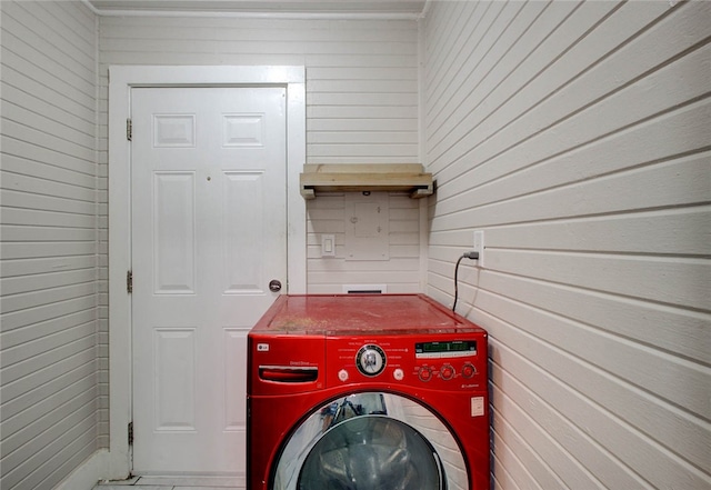 laundry room with washer / clothes dryer and wooden walls