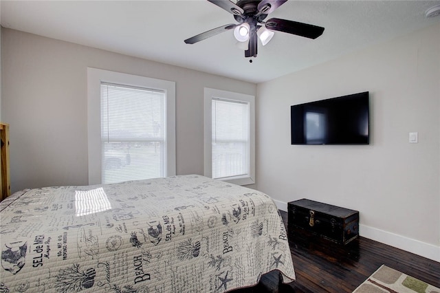 bedroom featuring dark hardwood / wood-style flooring and ceiling fan