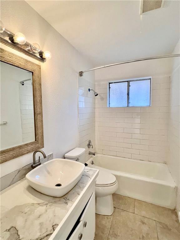 4505 Mount Vernon Dr, Corpus Christi, TX 78411 - full bath featuring vanity, shower / washtub combination, and tile patterned flooring
