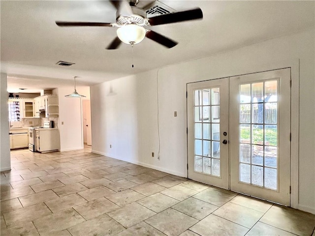 4505 Mount Vernon Dr, Corpus Christi, TX 78411 - unfurnished living room featuring french doors, a ceiling fan, and light tile patterned floors