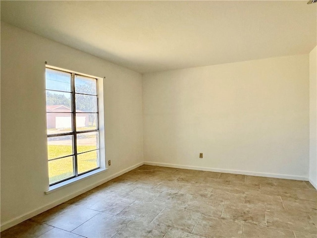 4505 Mount Vernon Dr, Corpus Christi, TX 78411 - unfurnished room featuring plenty of natural light and light stone finish floors