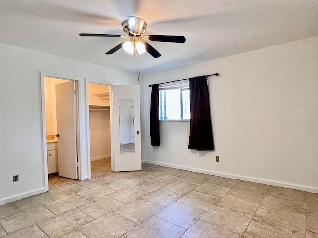 4505 Mount Vernon Dr, Corpus Christi, TX 78411 - unfurnished bedroom featuring a spacious closet, a closet, ceiling fan, and ensuite bathroom