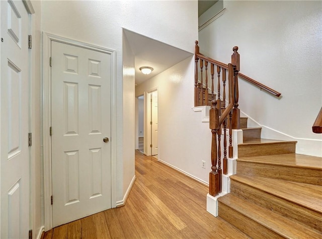 staircase featuring hardwood / wood-style floors