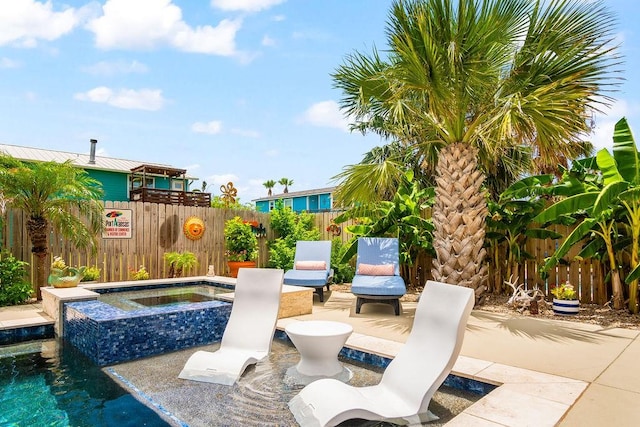 view of patio with an in ground hot tub, fence, and a fenced in pool