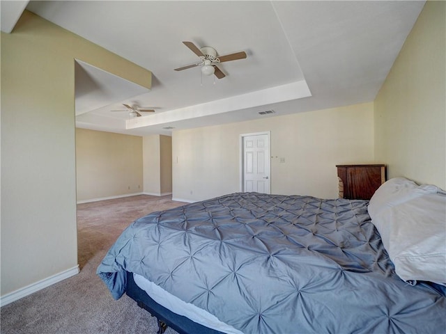 14422 Verdemar Dr, Corpus Christi, TX 78418 - carpeted bedroom with a tray ceiling, baseboards, visible vents, and a ceiling fan