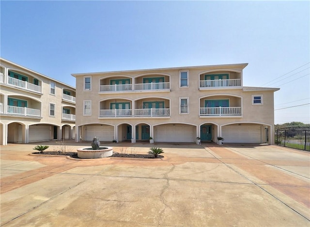 14422 Verdemar Dr, Corpus Christi, TX 78418 - view of front of property featuring stucco siding, concrete driveway, and a garage