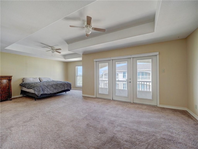 14422 Verdemar Dr, Corpus Christi, TX 78418 - carpeted bedroom with a tray ceiling, access to outside, french doors, and baseboards