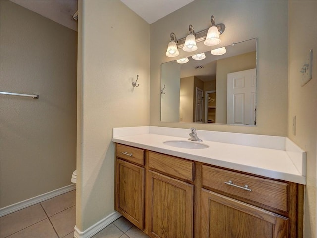 14422 Verdemar Dr, Corpus Christi, TX 78418 - bathroom with vanity, visible vents, baseboards, tile patterned flooring, and toilet
