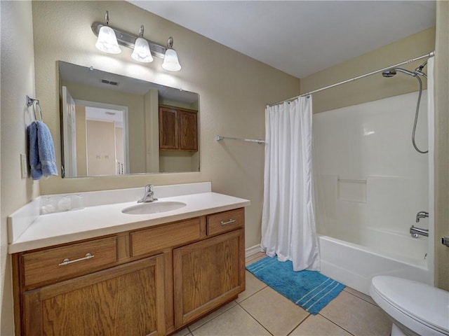 14422 Verdemar Dr, Corpus Christi, TX 78418 - full bath featuring vanity, visible vents, shower / bath combination with curtain, tile patterned floors, and toilet