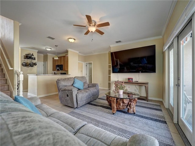 14422 Verdemar Dr, Corpus Christi, TX 78418 - living room with visible vents, crown molding, stairway, light tile patterned flooring, and a ceiling fan