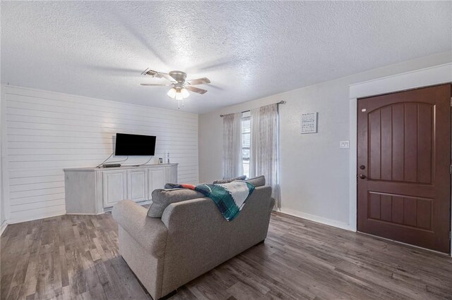 110 Wildwood, Rockport, TX 78382 - living room with ceiling fan, wood finished floors, and a textured ceiling