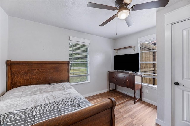 110 Wildwood, Rockport, TX 78382 - bedroom with wood finished floors and ceiling fan