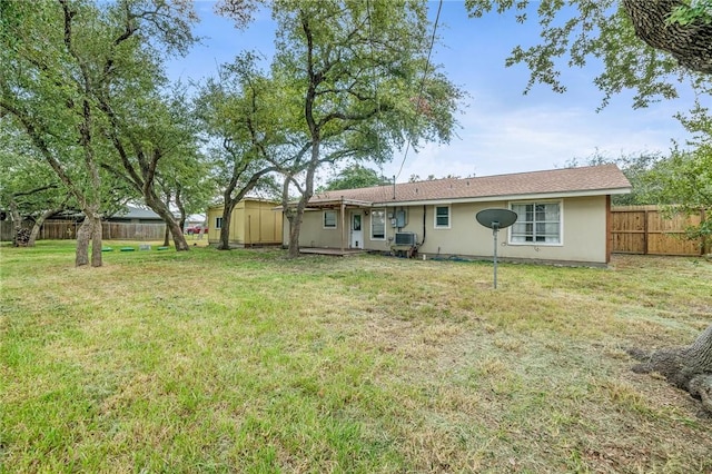 110 Wildwood, Rockport, TX 78382 - rear view of property with a fenced backyard and stucco siding
