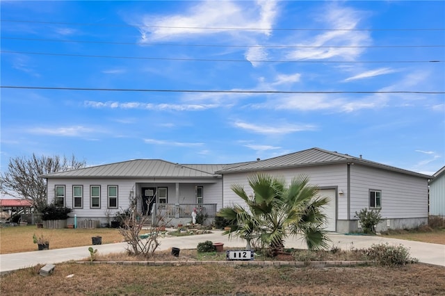 view of front of house with a porch and a garage