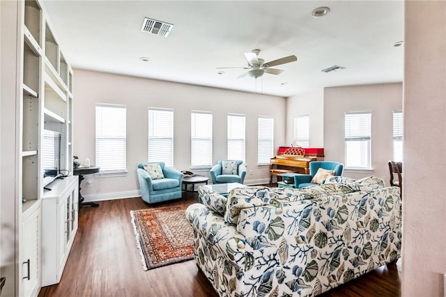 living room with dark hardwood / wood-style floors and ceiling fan
