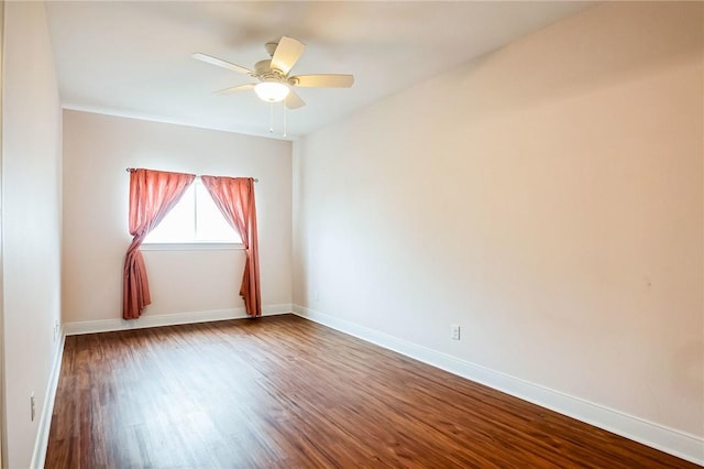 empty room with ceiling fan and hardwood / wood-style floors