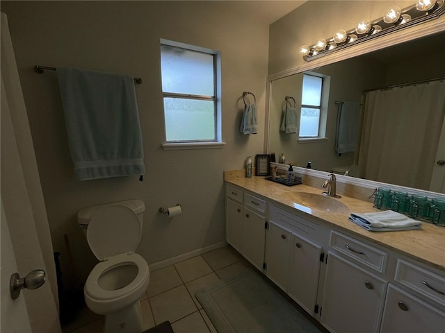 bathroom featuring a shower with curtain, toilet, baseboards, tile patterned flooring, and vanity