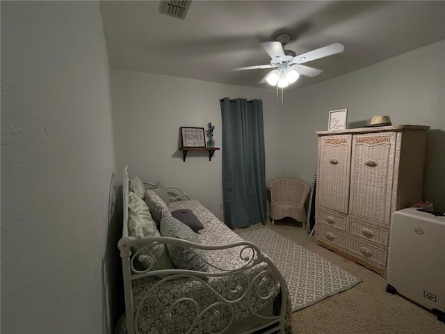 bedroom with visible vents, carpet, and ceiling fan