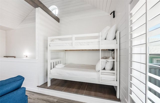 bedroom featuring wood-type flooring and lofted ceiling