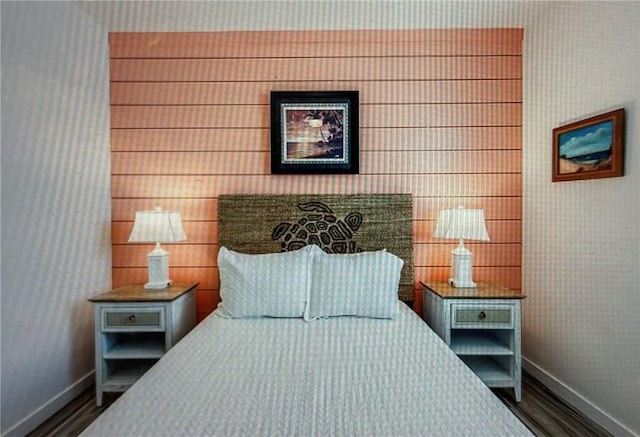 bedroom featuring dark hardwood / wood-style flooring