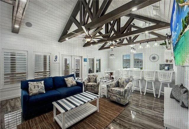 living room with hardwood / wood-style flooring, high vaulted ceiling, and beamed ceiling