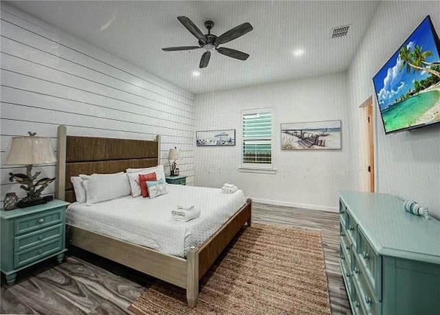 bedroom featuring dark wood-type flooring and ceiling fan