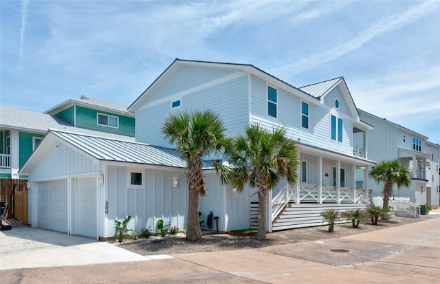 view of front of property featuring a garage and covered porch