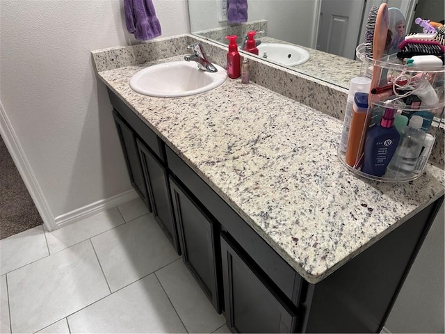 bathroom featuring tile patterned flooring and vanity