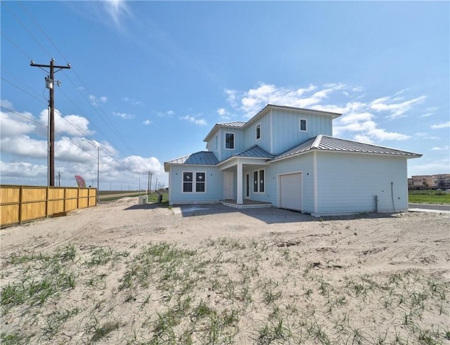 7518 Ruby Bay Ct, Port Aransas, TX 78373 - back of house with fence, a standing seam roof, and metal roof