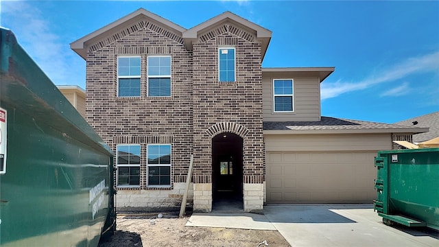 10313 Stone Creek Dr, Corpus Christi, TX 78410 - view of front of home with brick siding, driveway, and a garage