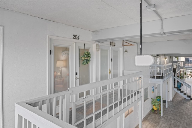 interior space with wood-type flooring and french doors