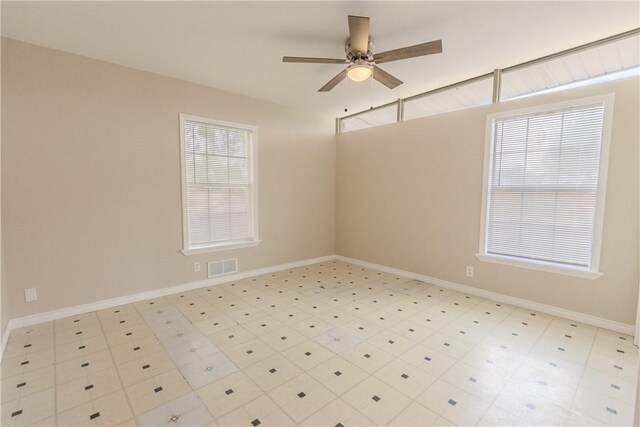 1553 Casa Grande Dr, Corpus Christi, TX 78411 - empty room featuring plenty of natural light, a ceiling fan, and baseboards