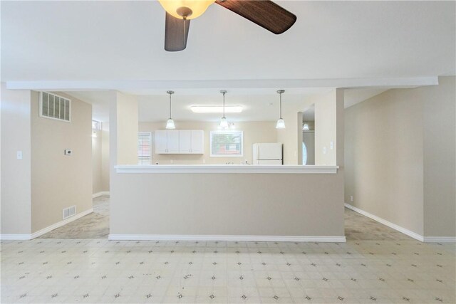 1553 Casa Grande Dr, Corpus Christi, TX 78411 - unfurnished living room with light flooring, baseboards, and ceiling fan