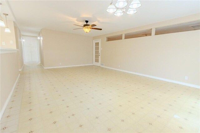 1553 Casa Grande Dr, Corpus Christi, TX 78411 - spare room with ceiling fan, a chandelier, and baseboards