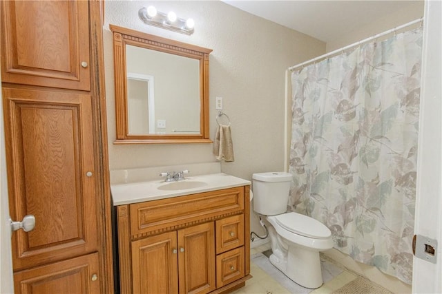 1553 Casa Grande Dr, Corpus Christi, TX 78411 - full bath with vanity, toilet, tile patterned floors, and curtained shower