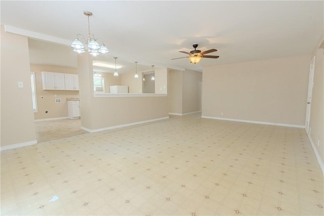 1553 Casa Grande Dr, Corpus Christi, TX 78411 - unfurnished living room featuring ceiling fan, light floors, baseboards, and a chandelier