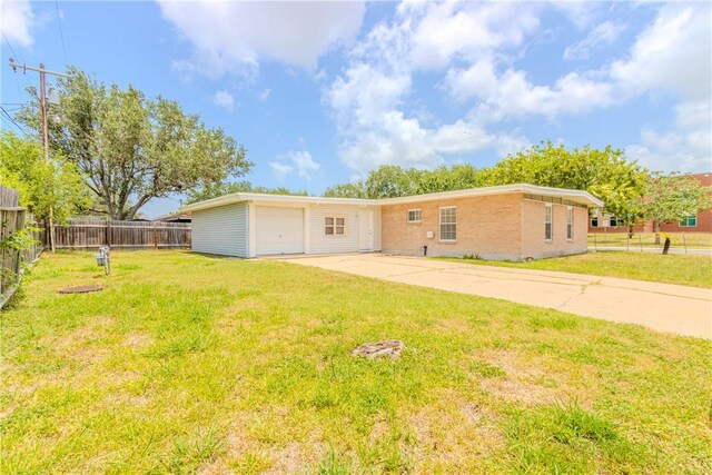 1553 Casa Grande Dr, Corpus Christi, TX 78411 - rear view of property with driveway and brick siding