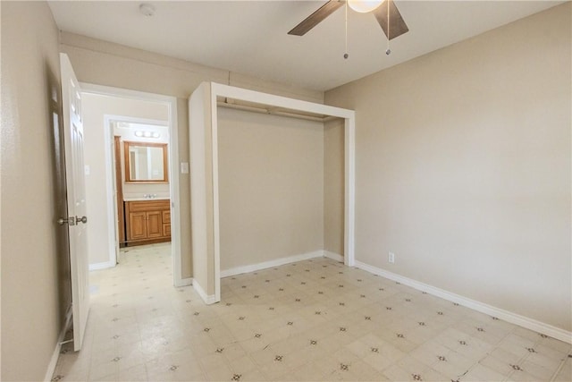 1553 Casa Grande Dr, Corpus Christi, TX 78411 - unfurnished bedroom with light floors, a closet, a ceiling fan, and baseboards