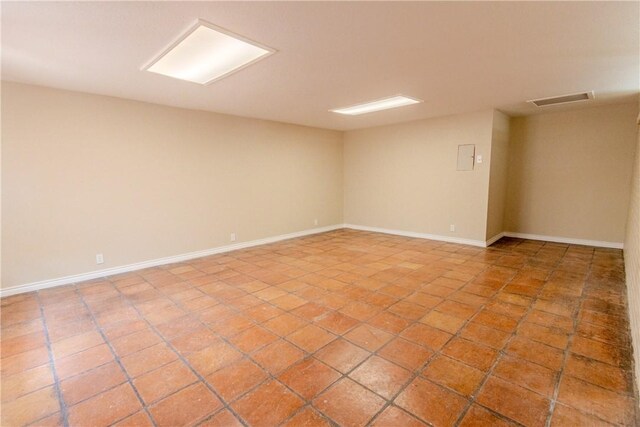 1553 Casa Grande Dr, Corpus Christi, TX 78411 - spare room featuring baseboards and light tile patterned flooring